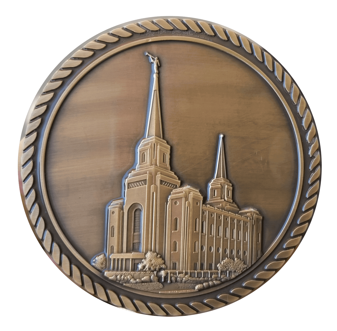 A bronze medal with the image of an lds temple.