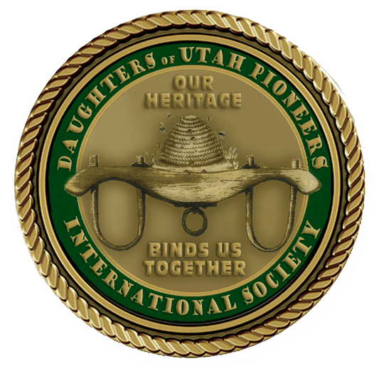 A gold colored medal with the words daughters of utah pioneers international society in it.
