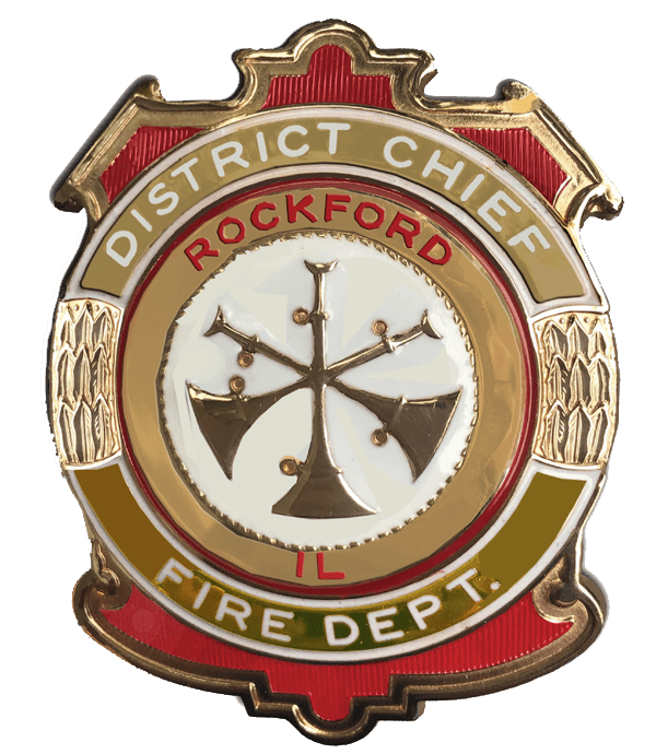 A badge that says district chief fire department.