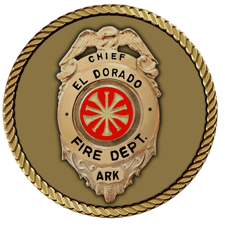 A gold and red badge with the words chief el dorado fire department in it.