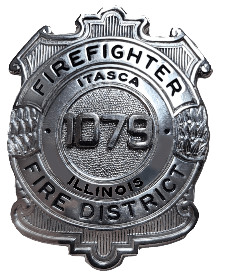 A silver fire department badge with the words " firefighter fire district itasca illinois 1 0 7 9."