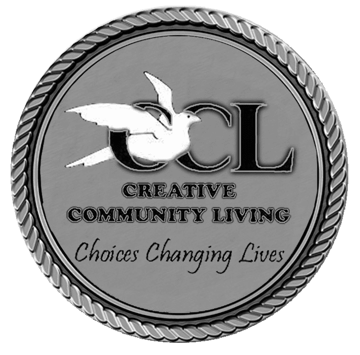 A silver medal with the words creative community living on it.