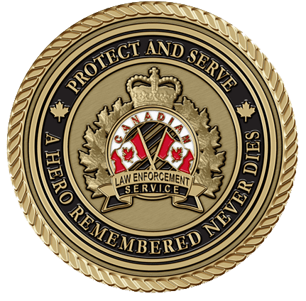 A gold colored coin with the canadian flag and maple leaf on it.