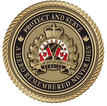 A gold colored coin with the canadian flag and maple leaf on it.