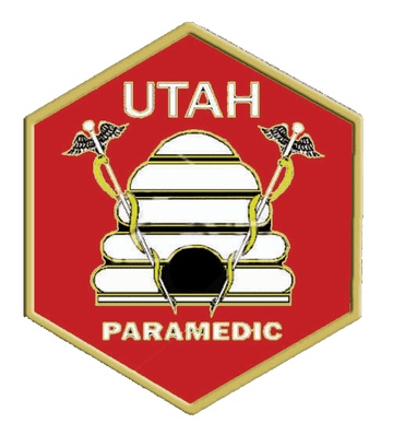A red and gold badge with the words utah paramedic written underneath it.