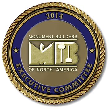 A gold and blue medallion with the logo of monument builders of north america.