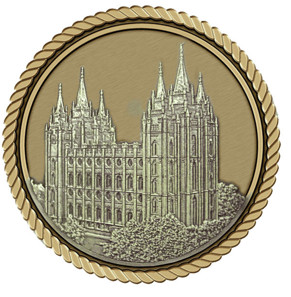 A gold medal with a picture of the salt lake temple.