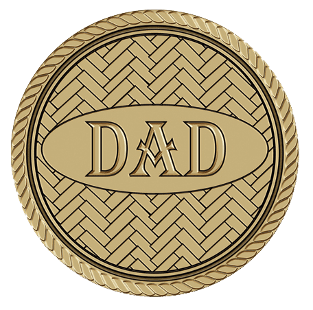 A gold medal with the word dad on it.