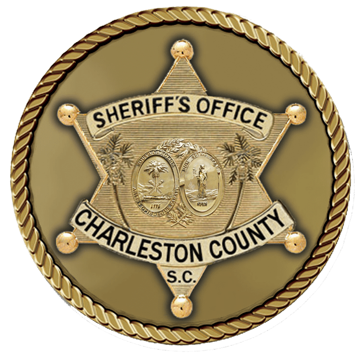 A gold sheriff 's badge with the words " sheriffs office charleston county s. C."