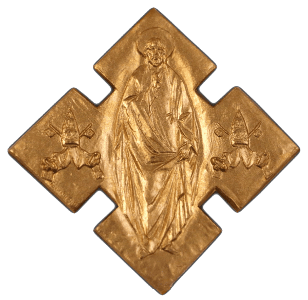 A gold cross with jesus and angels on it.