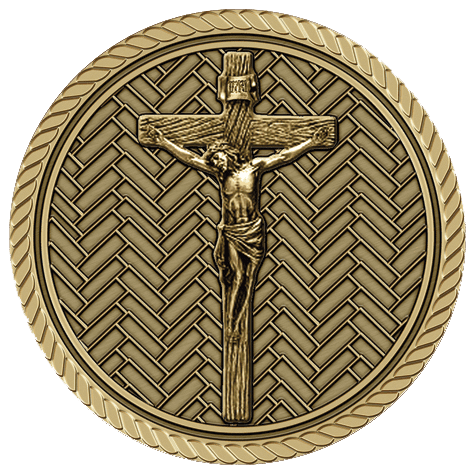 A gold medal with a cross and jesus on it